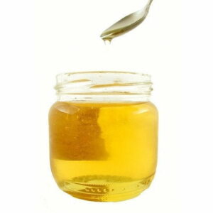 Jar Of Golden Honey With Dripping Spoon Above, Brand Name &Quot;Dm Traders Organic Store&Quot;.