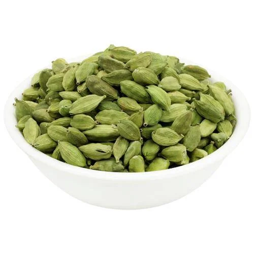 A White Bowl Filled With Green Cardamom From Dm Traders Organic Store.