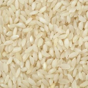 Close-up of organic white rice grains from DM Traders Organic Store.