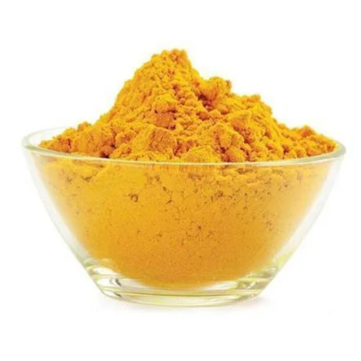 Glass Bowl Filled With Bright Yellow Turmeric Powder From Dm Traders Organic Store.