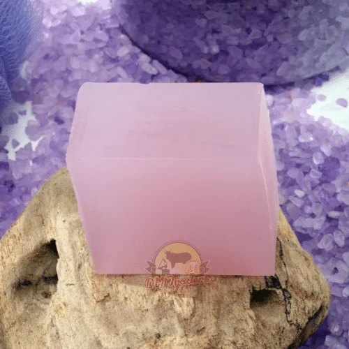 Pink Lavender Soap Bar From Dm Traders Organic Store, Placed On A Wooden Surface With Purple Crystals In The Background.