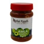 Jar Of Nellai Foods Amla Pickle With A Red Cap, Labelled In English And Tamil.