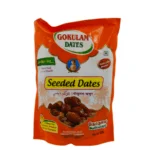 A Packet Of Gokulam Seeded Dates In An Orange And White Packaging With Some Text In Multiple Languages And An Illustration Of Dates.